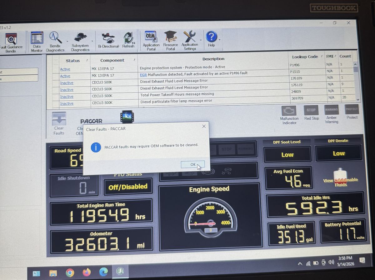 Diagnostic software on a rugged laptop reading truck fault codes